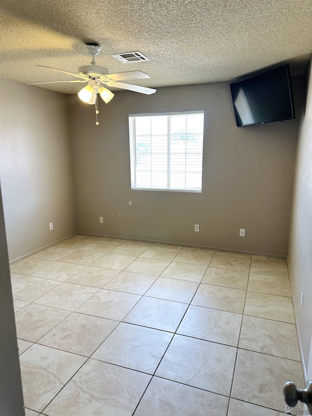 4732 W 17th Ln, Yuma, AZ 85364 - spare room with a ceiling fan, light tile patterned floors, and a textured ceiling