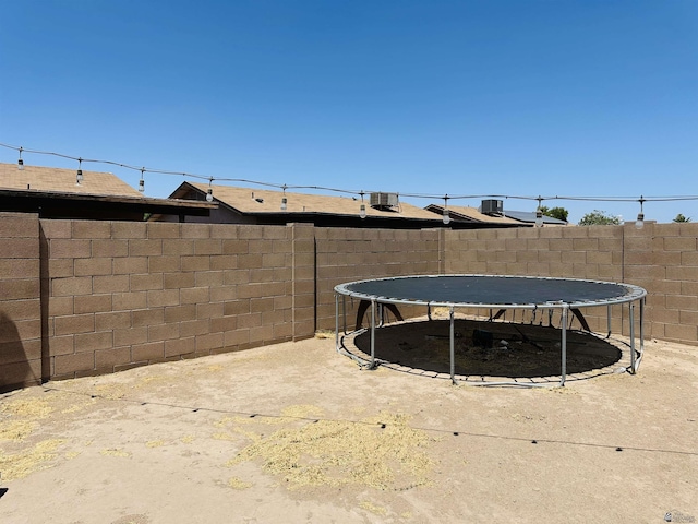 4732 W 17th Ln, Yuma, AZ 85364 - fenced backyard featuring a trampoline