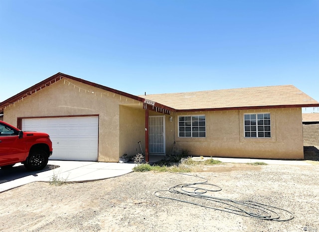 4732 W 17th Ln, Yuma, AZ 85364 - ranch-style home with a garage, stucco siding, and driveway