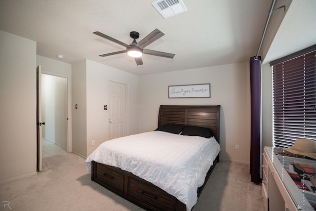 7850 E 44th Pl, Yuma, AZ 85365 - bedroom with baseboards, ceiling fan, light carpet, and visible vents