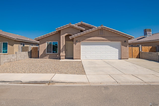 7850 E 44th Pl, Yuma, AZ 85365 - single story home with an attached garage, stucco siding, fence, and driveway