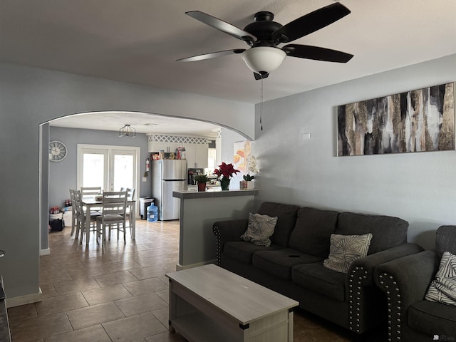 1763 W 24th Dr, Yuma, AZ 85364 - tiled living area featuring arched walkways and a ceiling fan