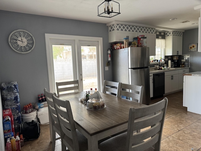 1763 W 24th Dr, Yuma, AZ 85364 - dining space featuring light tile patterned flooring and a chandelier