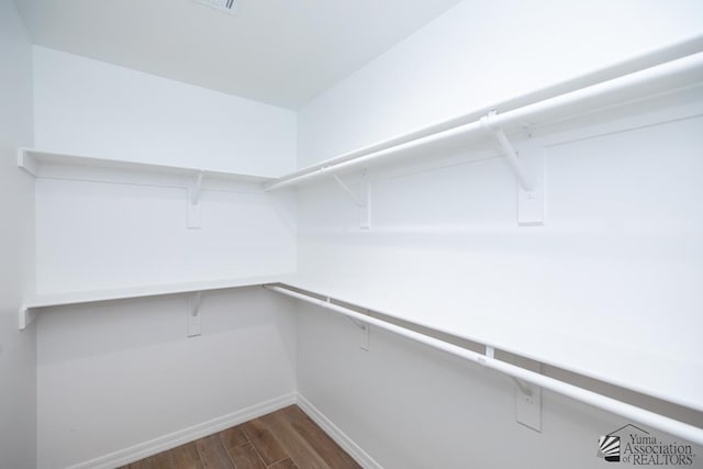 12690 E 51st Pl, Yuma, AZ 85367 - walk in closet featuring dark wood finished floors