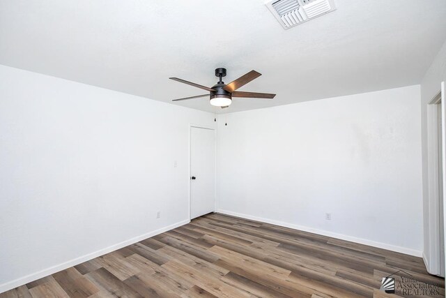 1934 S Athens Ave, Yuma, AZ 85364 - unfurnished room featuring wood finished floors, ceiling fan, and baseboards