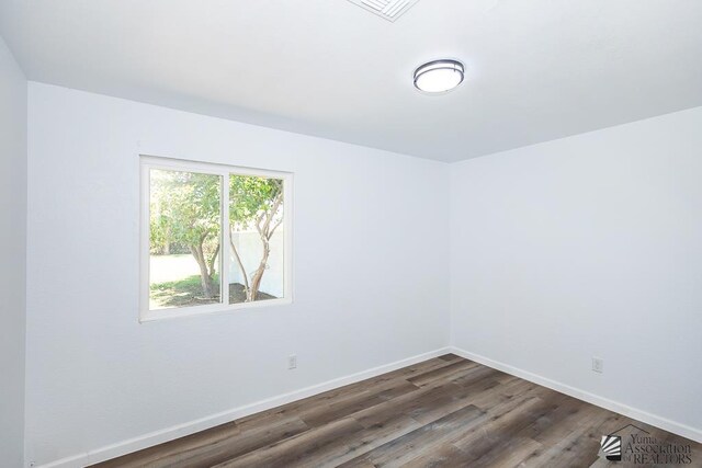 1934 S Athens Ave, Yuma, AZ 85364 - empty room featuring wood finished floors and baseboards