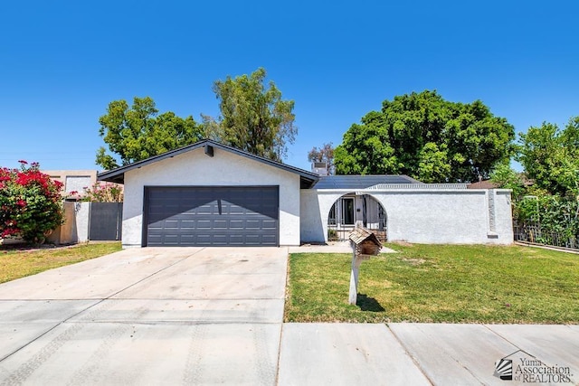 1934 S Athens Ave, Yuma, AZ 85364 - ranch-style house with a garage, stucco siding, and concrete driveway