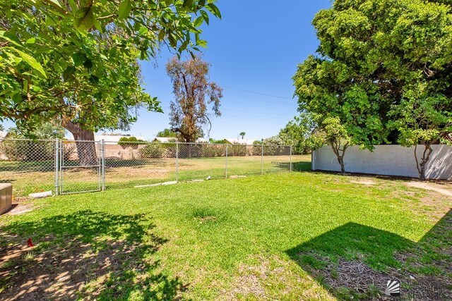 1934 S Athens Ave, Yuma, AZ 85364 - view of yard featuring a gate