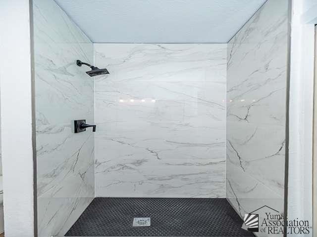 1934 S Athens Ave, Yuma, AZ 85364 - full bathroom featuring a marble finish shower