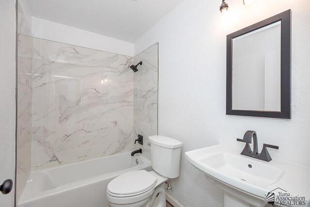 1934 S Athens Ave, Yuma, AZ 85364 - bathroom featuring toilet, shower / tub combination, and a sink