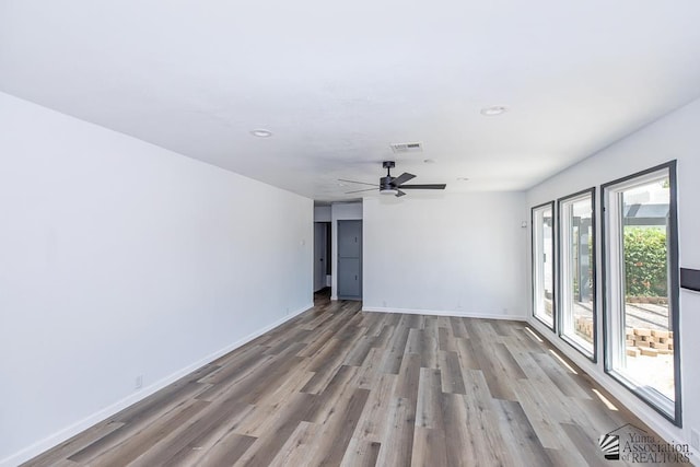 1934 S Athens Ave, Yuma, AZ 85364 - unfurnished room with wood finished floors, baseboards, ceiling fan, and recessed lighting