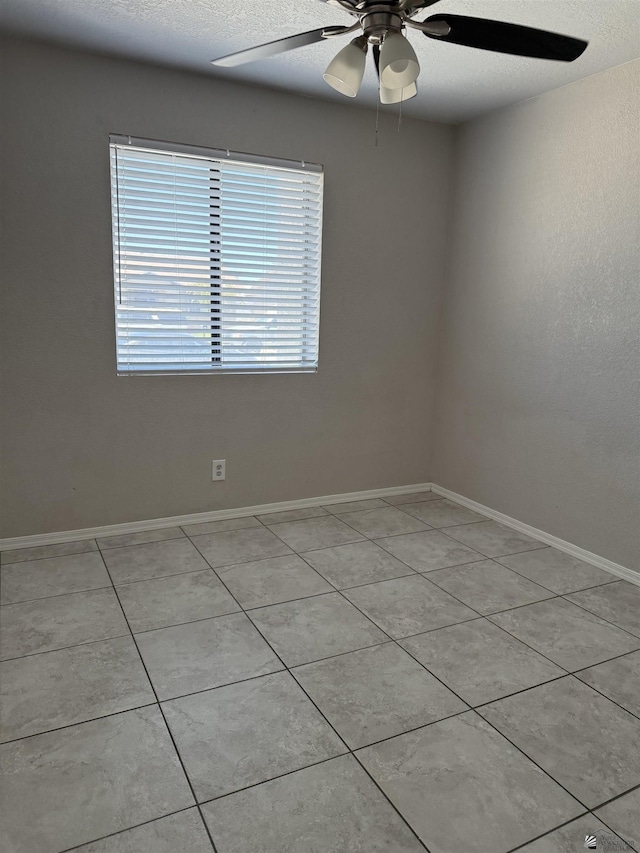 1435 S Thomas Ave, Yuma, AZ 85364 - unfurnished room featuring ceiling fan, light tile patterned flooring, and baseboards