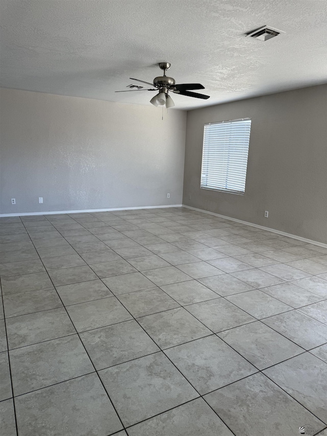 1435 S Thomas Ave, Yuma, AZ 85364 - unfurnished room with a textured ceiling, baseboards, and a ceiling fan