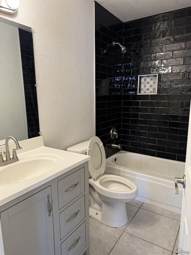 1435 S Thomas Ave, Yuma, AZ 85364 - bathroom with a textured wall, tile patterned floors,  shower combination, vanity, and toilet