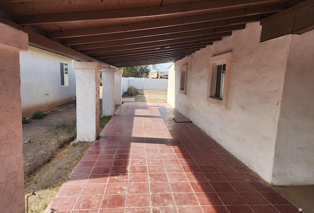 view of patio / terrace featuring fence