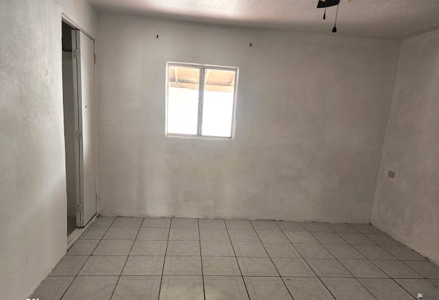 unfurnished room with light tile patterned floors
