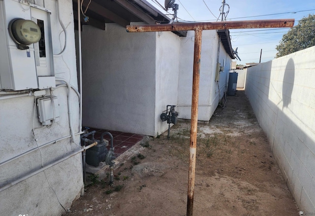 view of side of home with fence