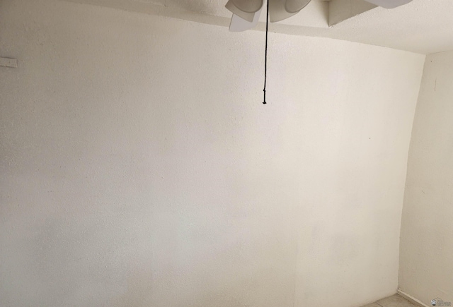 interior space with a ceiling fan