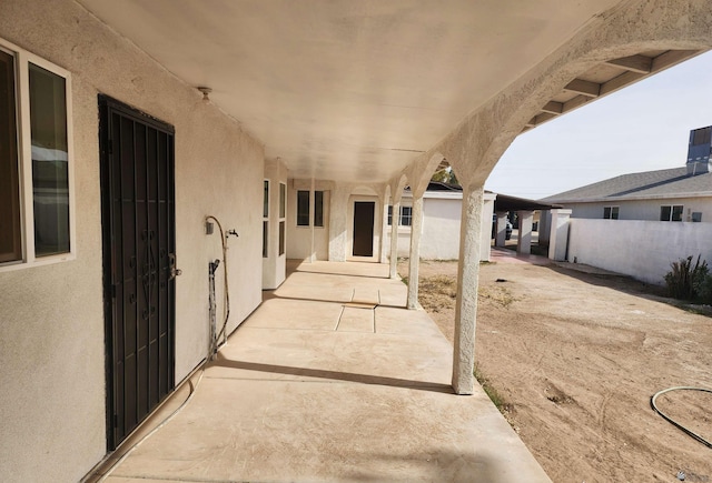 view of patio featuring fence
