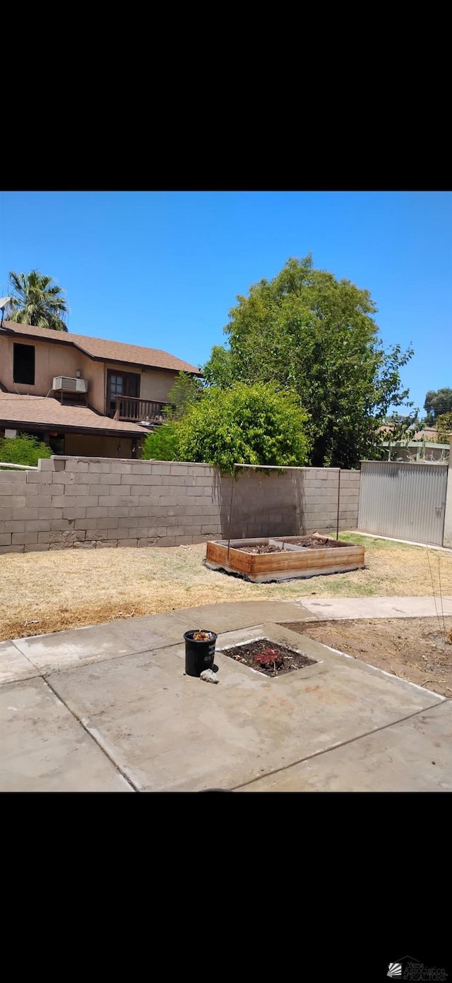 1228 S 40th Dr, Yuma, AZ 85364 - fenced backyard featuring a fire pit and a patio area