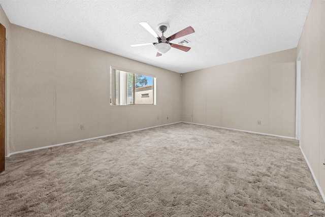 1228 S 40th Dr, Yuma, AZ 85364 - carpeted spare room featuring ceiling fan, a textured ceiling, and baseboards
