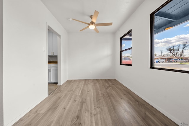 321 S 23rd Ave, Yuma, AZ 85364 - unfurnished room with ceiling fan, baseboards, and light wood-style floors