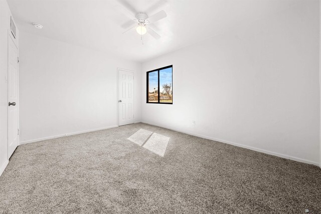 321 S 23rd Ave, Yuma, AZ 85364 - carpeted spare room featuring baseboards, a ceiling fan, and visible vents