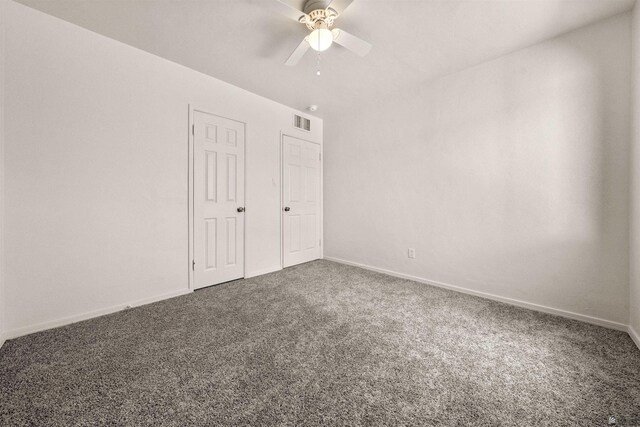 321 S 23rd Ave, Yuma, AZ 85364 - unfurnished bedroom with baseboards, visible vents, ceiling fan, and carpet