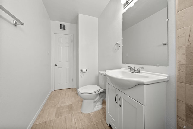 321 S 23rd Ave, Yuma, AZ 85364 - full bath featuring toilet, baseboards, visible vents, and vanity