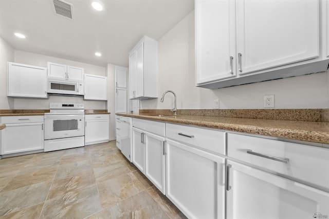 321 S 23rd Ave, Yuma, AZ 85364 - kitchen with a sink, white appliances, white cabinetry, recessed lighting, and visible vents