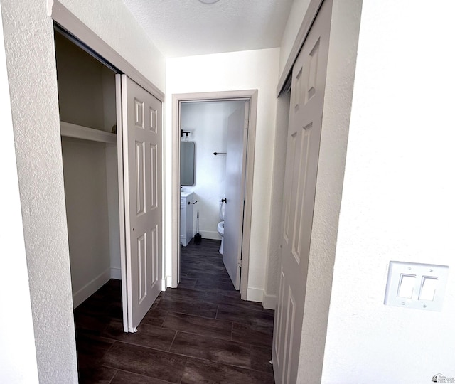 2472 S 18th Ave, Yuma, AZ 85364 - hallway with dark wood-style floors and baseboards