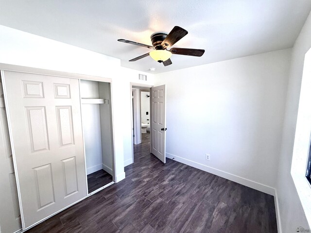 2472 S 18th Ave, Yuma, AZ 85364 - unfurnished bedroom featuring a closet, dark wood-style floors, and a ceiling fan