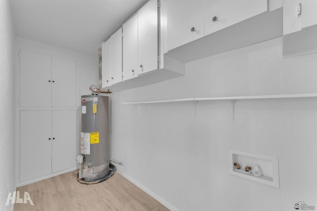 utility room featuring water heater