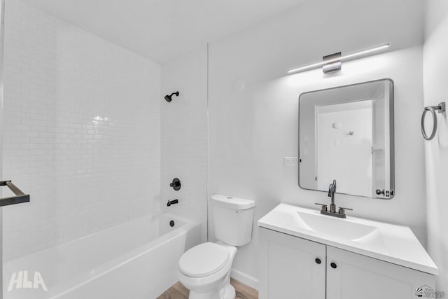 full bathroom featuring vanity, shower / bathing tub combination, wood finished floors, and toilet