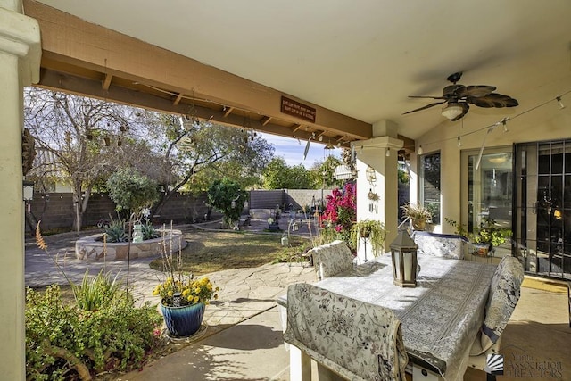 2877 W 13th Pl, Yuma, AZ 85365 - view of patio / terrace with outdoor dining area, a fenced backyard, and ceiling fan
