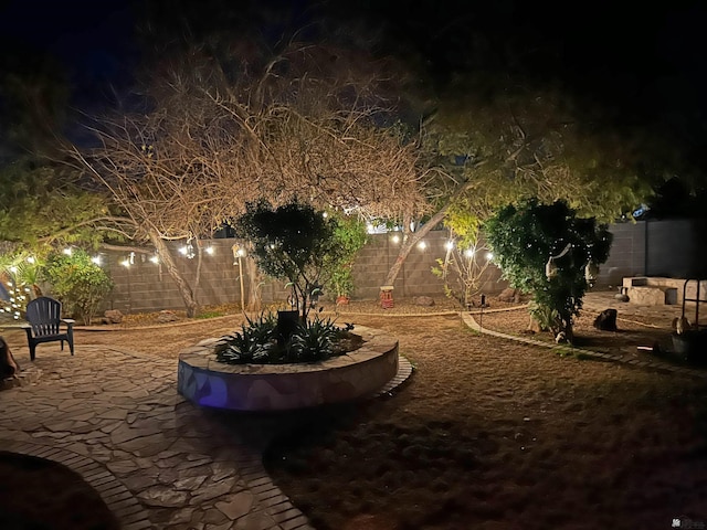 2877 W 13th Pl, Yuma, AZ 85365 - yard at twilight featuring a fenced backyard and a patio area