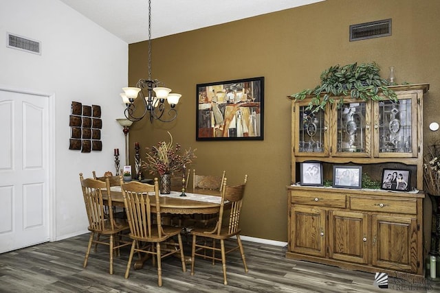 2877 W 13th Pl, Yuma, AZ 85365 - dining room featuring vaulted ceiling, dark wood-style floors, a chandelier, and visible vents