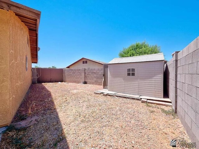 8576 E 38th St, Yuma, AZ 85365 - fenced backyard with a shed