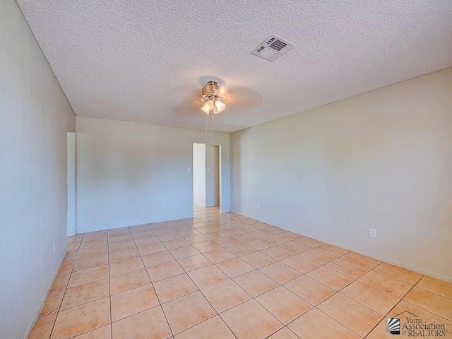 8576 E 38th St, Yuma, AZ 85365 - unfurnished room with a ceiling fan, a textured ceiling, and light tile patterned floors