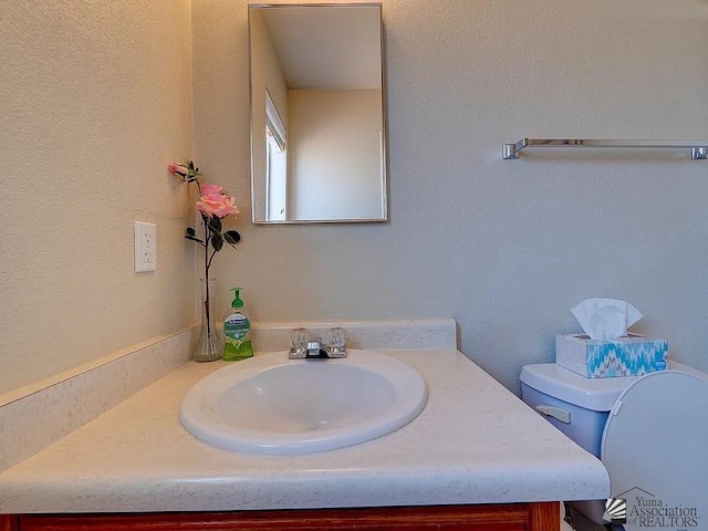 8576 E 38th St, Yuma, AZ 85365 - bathroom with vanity and toilet