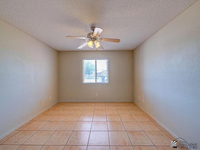 8576 E 38th St, Yuma, AZ 85365 - unfurnished room with ceiling fan, a textured ceiling, and light tile patterned flooring
