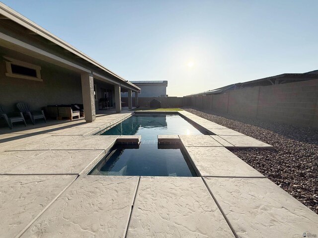 14650 E 42nd Pl, Yuma, AZ 85367 - view of swimming pool featuring a fenced backyard, a patio, an outdoor living space, and a pool with connected hot tub