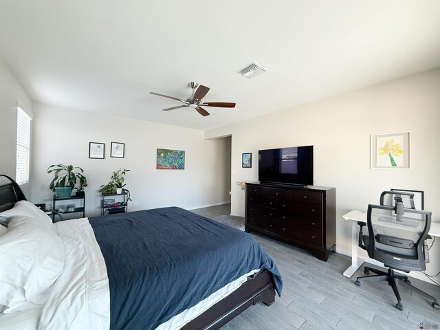 14650 E 42nd Pl, Yuma, AZ 85367 - bedroom with wood finish floors, ceiling fan, and baseboards