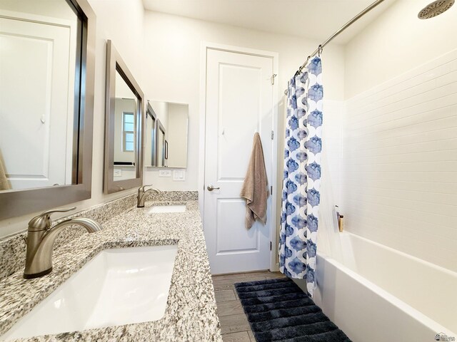 14650 E 42nd Pl, Yuma, AZ 85367 - bathroom with shower / tub combo, double vanity, and wood finished floors