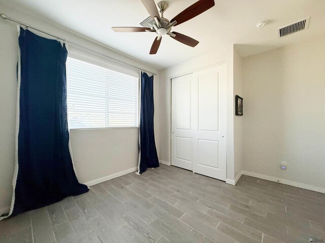 14650 E 42nd Pl, Yuma, AZ 85367 - unfurnished bedroom featuring baseboards, a closet, light wood-type flooring, and ceiling fan