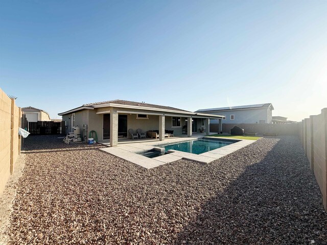 14650 E 42nd Pl, Yuma, AZ 85367 - rear view of property featuring stucco siding, a fenced backyard, and a patio area