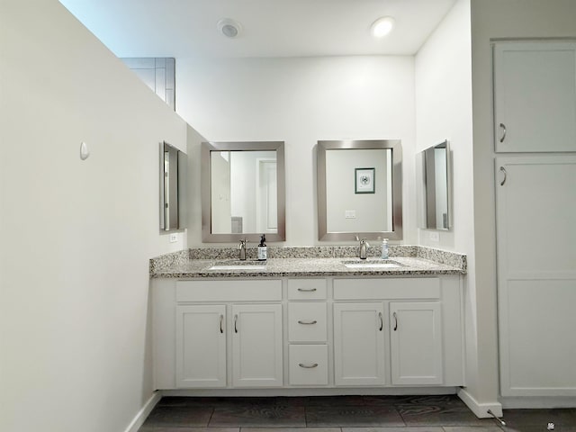 14650 E 42nd Pl, Yuma, AZ 85367 - bathroom featuring double vanity and baseboards