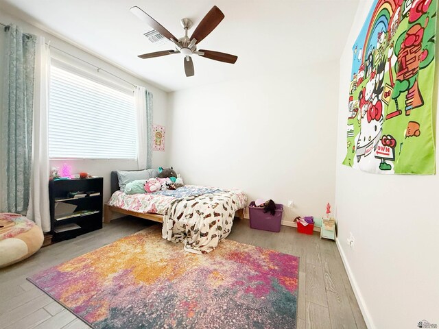 14650 E 42nd Pl, Yuma, AZ 85367 - bedroom featuring wood-type flooring, baseboards, and a ceiling fan