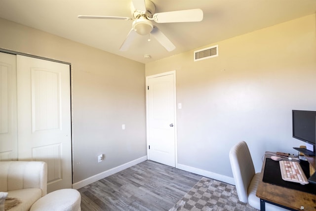 office with wood finished floors, ceiling fan, and baseboards