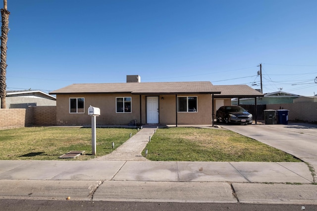 ranch-style house featuring a carport, stucco siding, concrete driveway, and a chimney